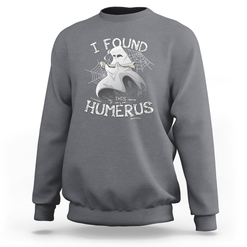 Light gray sweatshirt with front “I FOUND THIS HUMERUS” skeleton and spiderweb graphic