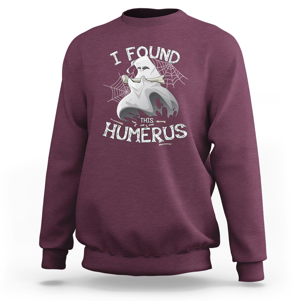 Maroon sweatshirt with front “I FOUND THIS HUMERUS” skeleton and spiderweb graphic