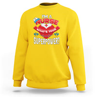 Daisy yellow nurse sweatshirt with “What’s Your Superpower?” graphic