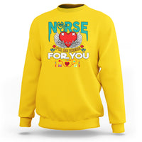 Daisy yellow nurse sweatshirt with 'I'll be there for you' graphic and nurse emblem on front