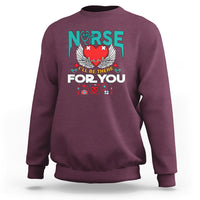 Maroon nurse sweatshirt with 'I'll be there for you' graphic and nurse emblem on front