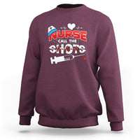Maroon nurse sweatshirt with “Call The Shots” graphic and syringe design