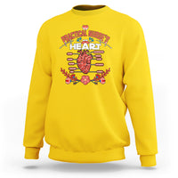 Daisy yellow nurse sweatshirt with “Practical Nurses' Heart” medical heart graphic