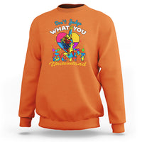 Orange autism awareness sweatshirt with colorful "Don't Judge What You Understand" graphic