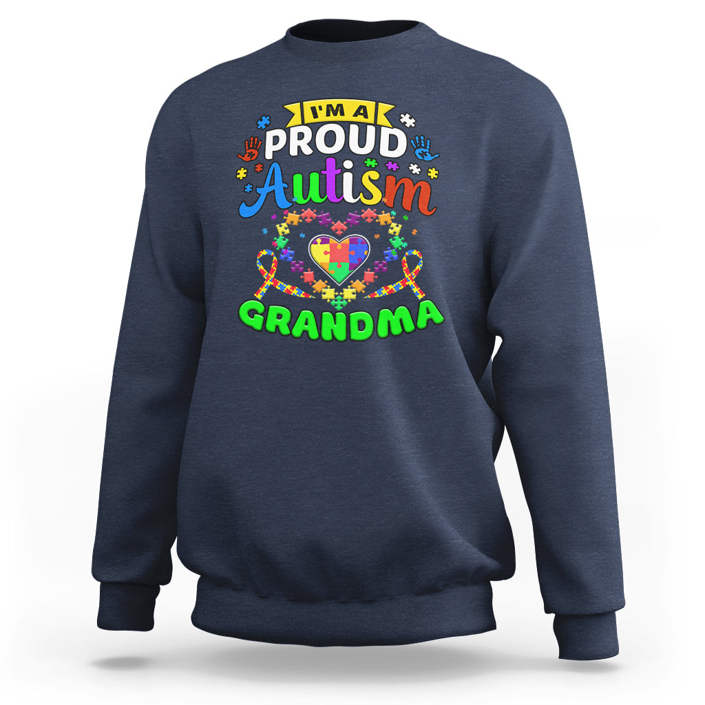 Navy crewneck sweatshirt with long sleeves and “Proud Autism Grandma” graphic