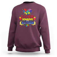 Maroon sweatshirt with colorful puzzle heart autism slogan graphic