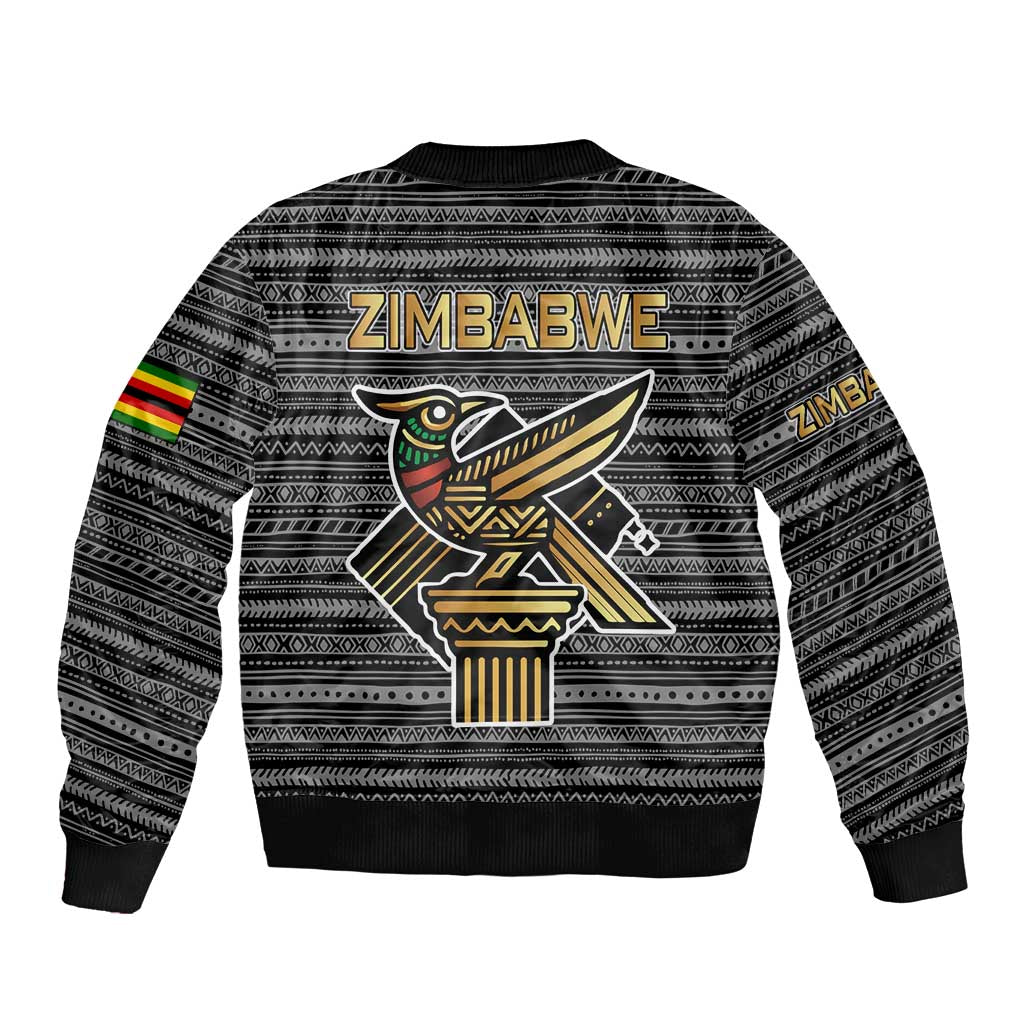 Black unisex bomber jacket, back tribal pattern with Zimbabwe bird graphic and rib hem.