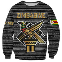 Unisex black sweatshirt with tribal pattern, Zimbabwe text, and bird emblem front print