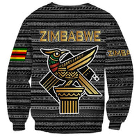 Unisex black sweatshirt back with tribal pattern, Zimbabwe text, and large bird emblem