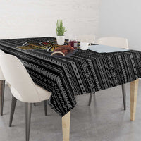 Black tribal print tablecloth with geometric motifs and bird emblem center