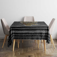 Black tribal pattern tablecloth on square table with matching chair arms