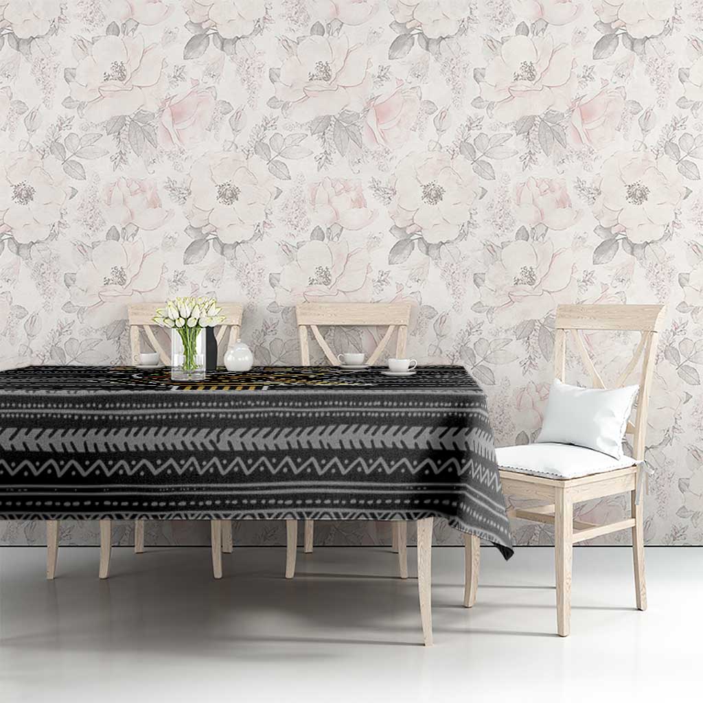 Black and white geometric tribal tablecloth on dining table with flowers centerpiece