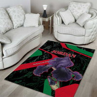 Black area rug with purple iris blooms and 'JORDAN' text on green/red stripes