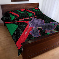 Black quilt bed set with Jordan word, purple figure, red and green angled panels