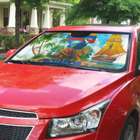 Car sun shade on red car windshield showing Ecuador wildlife and sailboat graphic