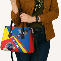 Multicolor leather shoulder tote with black top handles, condor patch, and red/blue side panel