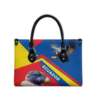 Multicolor Ecuador leather tote with black handles, top grommet studs, and condor print