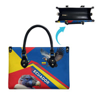 Multicolor leather tote bag with condor front print and black top handles; view of underside