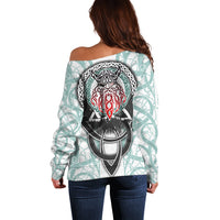 Off-shoulder printed sweater, back view with large circular shield graphic and long sleeves