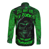 Black long-sleeve button shirt with green skull back graphic
