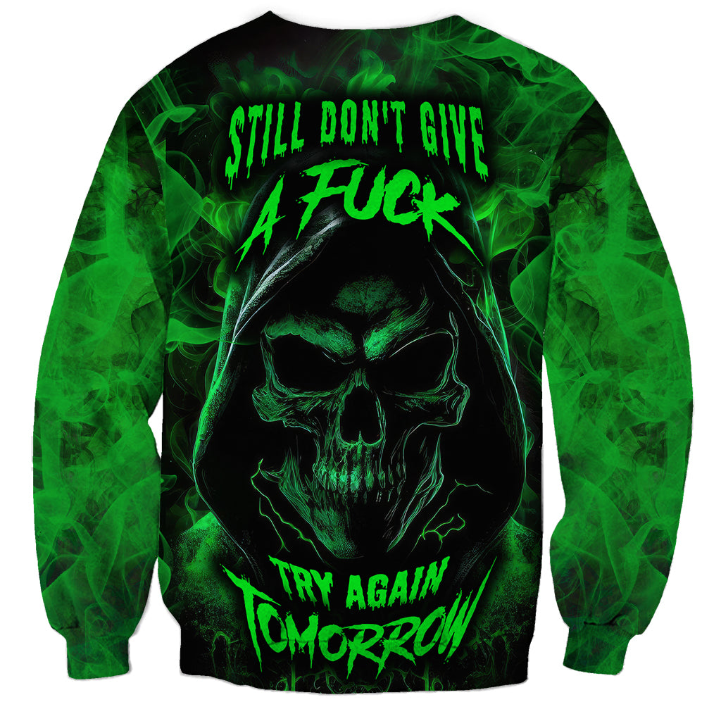 Black skull sweatshirt with neon green smoke graphic and “Try Again Tomorrow” text