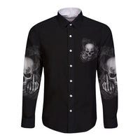 Black long-sleeve button shirt with front skull print and hand graphics on sleeves.