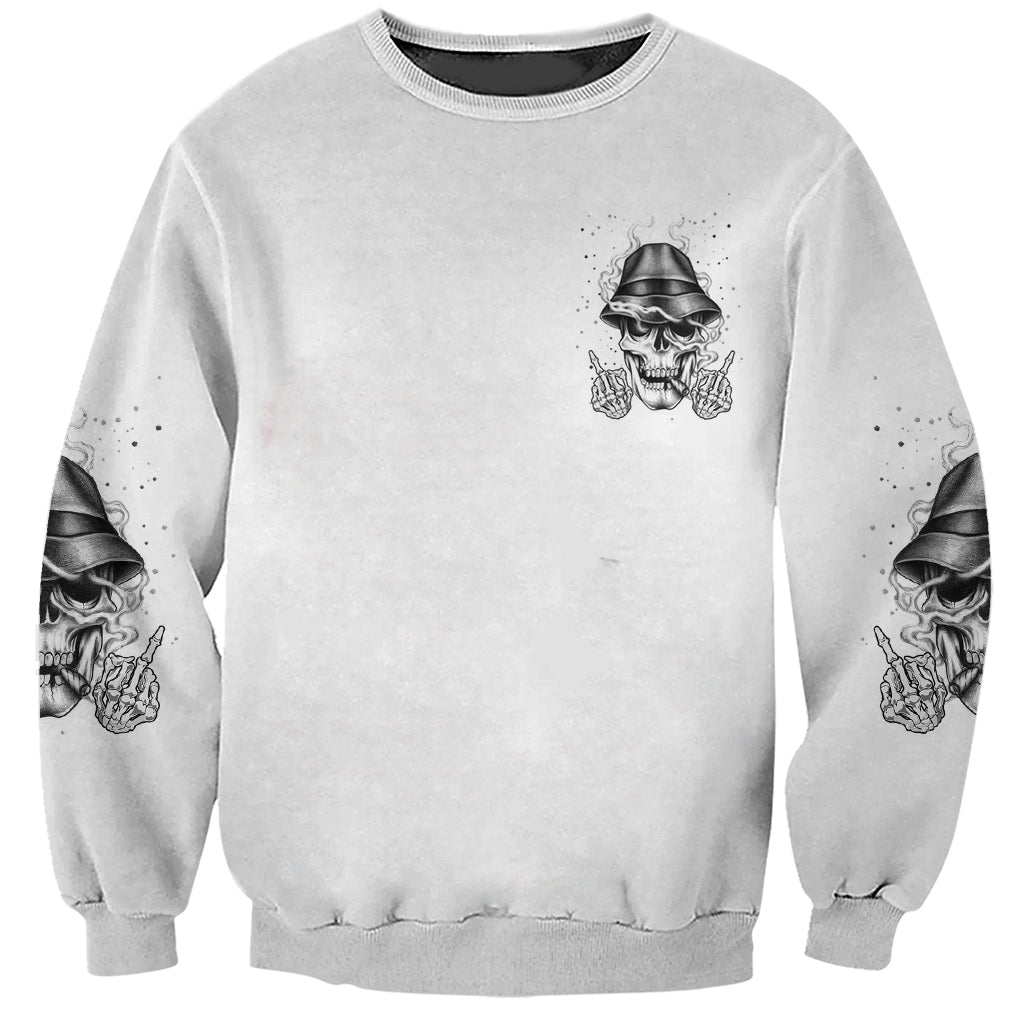 Grey crewneck sweatshirt with small front skull wearing hat graphic