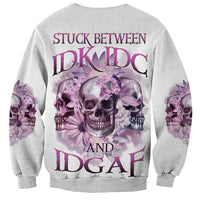 Unisex light gray skull sweatshirt with purple floral graphic and bold back text