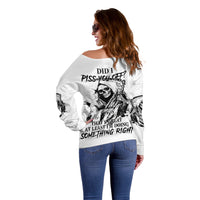 Off-shoulder white sweater with large skull and quote graphic on back, long sleeves
