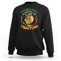 Black sweatshirt with colorful 'Good Luck' and 'You Traitor!' cat graphic on front