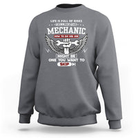 Charcoal gray mechanic graphic sweatshirt with winged emblem and slogan text