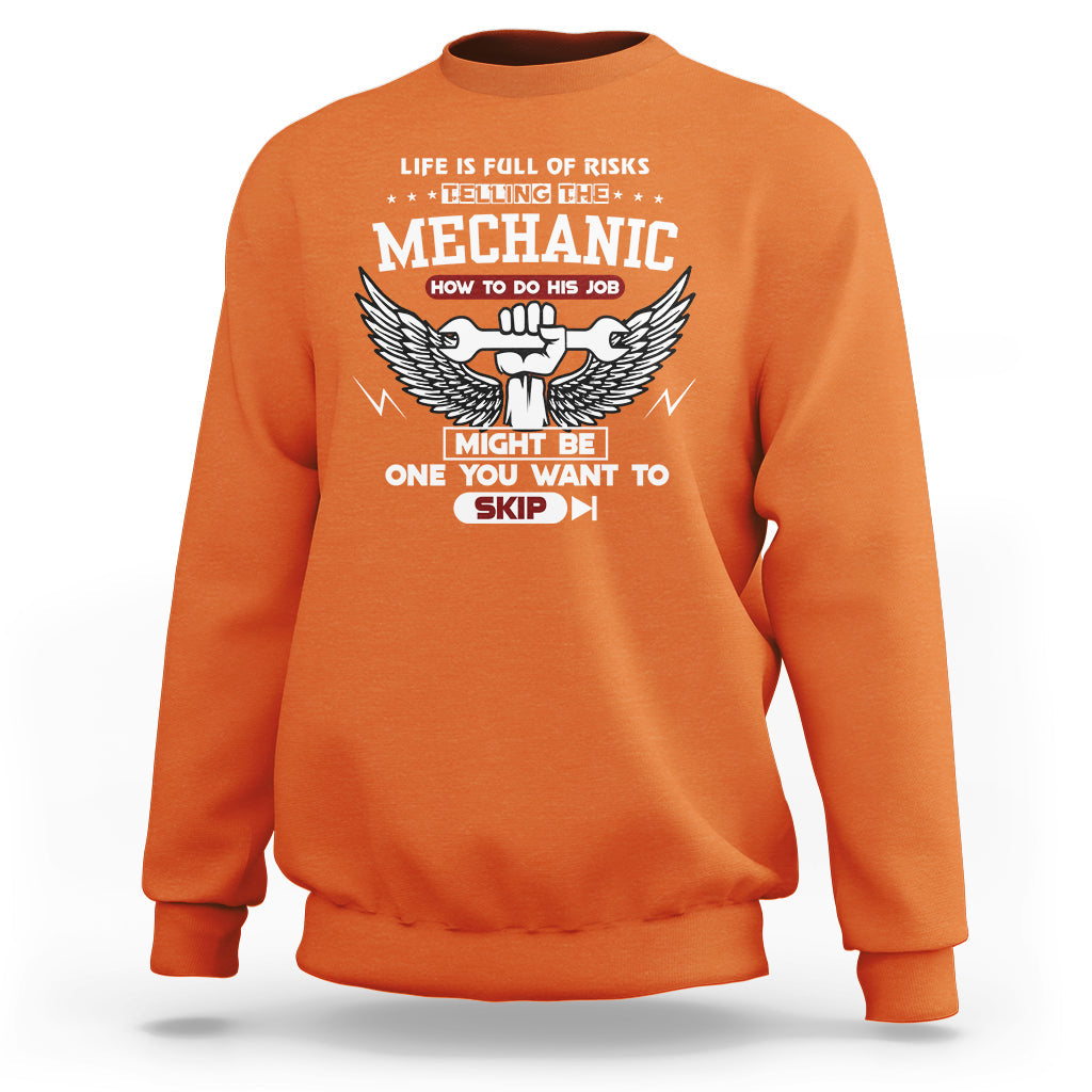 Orange mechanic graphic sweatshirt with winged emblem and slogan text on back