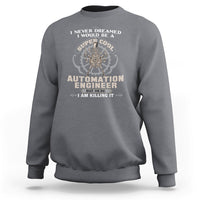 Heather gray crewneck sweatshirt with 'Automation Engineer' graphic and gear badge on chest.