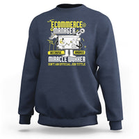 Navy crewneck sweatshirt with front “Ecommerce Manager” graphic and text.