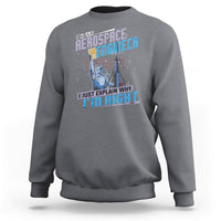 Charcoal gray crewneck sweatshirt with space engineer graphic and slogan on the front, long sleeves.