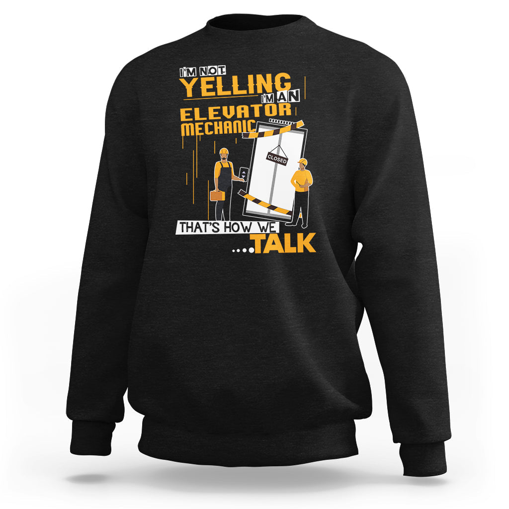 Black crewneck sweatshirt with elevator mechanic graphic and bold text on front