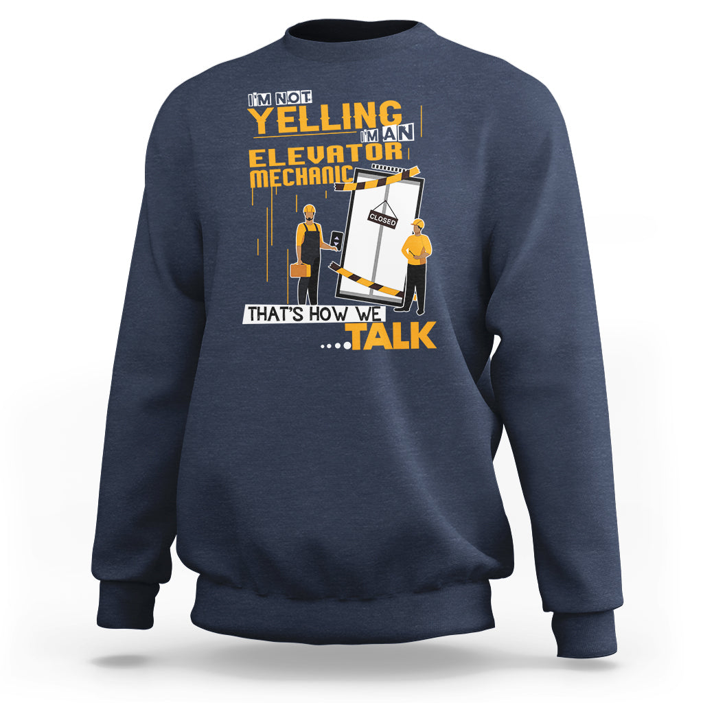 Navy crewneck sweatshirt with elevator mechanic graphic and bold text on front