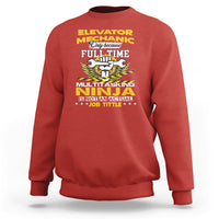 Red sweatshirt with “Elevator Mechanic” style graphic front and long sleeves