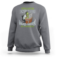 Charcoal gray crewneck sweatshirt with colorful “Application Engineer” and “Hard Work in Process” graphic.