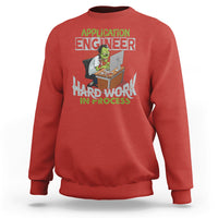 Red crewneck sweatshirt with colorful “Application Engineer” and “Hard Work in Process” graphic.