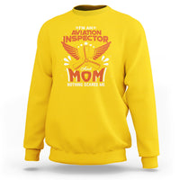 Daisy yellow crewneck sweatshirt with “Aviation Inspector Mom” eagle graphic on front
