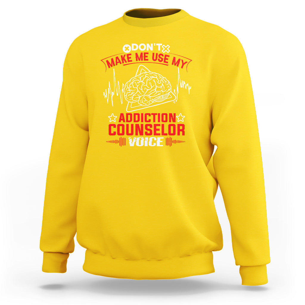 Daisy yellow sweatshirt with front print: brain graphic and stars, 'Addiction Counselor Voice'.