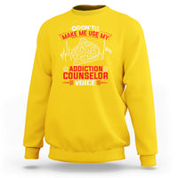 Daisy yellow sweatshirt with front print: brain graphic and stars, 'Addiction Counselor Voice'.