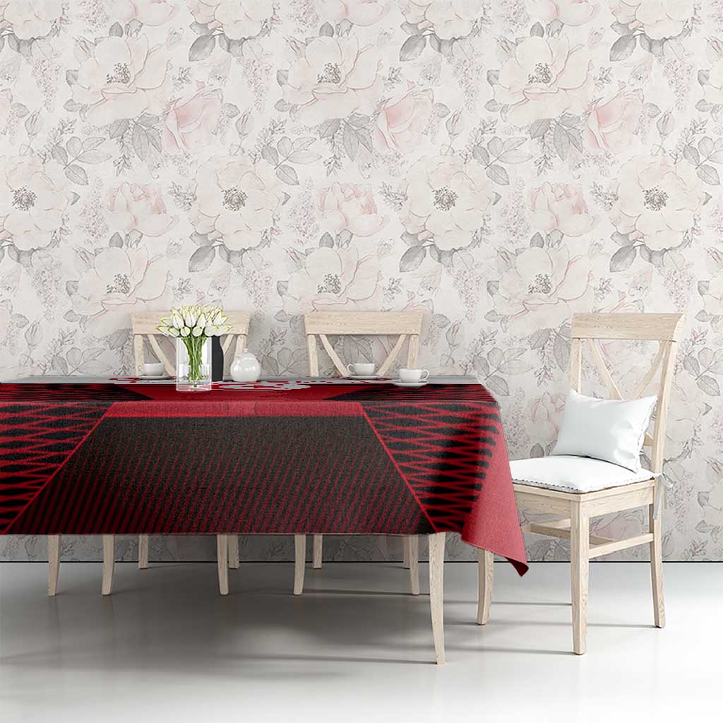 Red Tunisia tablecloth on long dining table with black geometric map section