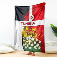Tunisia blanket draped with camel and jasmine flowers beneath Tunisia flag design, red white black