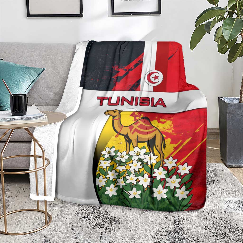 Tunisia blanket on a chair showing camel and jasmine flowers with Tunisia flag design