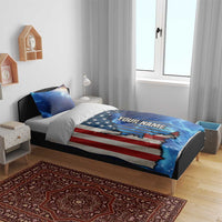 Patriotic bedding set on bed with blue galaxy U.S. flag map and 'YOUR NAME' on duvet