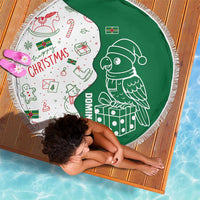 Green and white round beach blanket with parrot design and festive icons, fringed edge