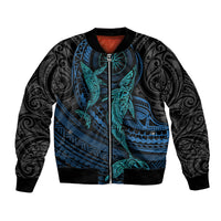 Unisex black bomber jacket with cyan whale and Polynesian patterns, ribbed hem and cuffs
