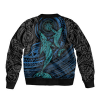 Unisex black bomber jacket with cyan whale and bold geometric Polynesian artwork, ribbed collar